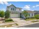 Charming two-story home with a three-car garage, lush lawn, and inviting curb appeal at 10144 E Toledo Ave, Mesa, AZ 85212