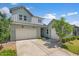 Beautiful two-story home featuring a three-car garage and landscaped front yard at 10144 E Toledo Ave, Mesa, AZ 85212