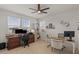Bright home office with two desks, ample natural light, and stylish decor, creating an inspiring workspace at 10144 E Toledo Ave, Mesa, AZ 85212