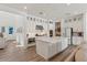 Bright kitchen with white cabinets, large island, stainless steel appliances and modern countertops at 10144 E Toledo Ave, Mesa, AZ 85212