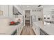 Well-lit kitchen featuring white cabinetry, stainless steel appliances, and a gas cooktop on sleek countertops at 10144 E Toledo Ave, Mesa, AZ 85212