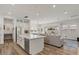 Open-concept kitchen flows into the living room and features a kitchen island and stainless appliances at 10144 E Toledo Ave, Mesa, AZ 85212