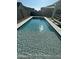 Sparkling rectangular pool surrounded by tile and artificial turf at 10144 E Toledo Ave, Mesa, AZ 85212