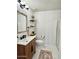 Bathroom featuring wood vanity, stylish fixtures, and decorative accents at 10229 N 12Th Ct # 1, Phoenix, AZ 85020