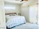 Bedroom features a ceiling fan, large window, and a plush white comforter at 10229 N 12Th Ct # 1, Phoenix, AZ 85020
