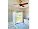 Bedroom featuring a ceiling fan, access to balcony, and neutral decor at 10229 N 12Th Ct # 1, Phoenix, AZ 85020