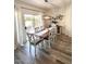 Cozy dining room with stylish chairs, decorative lighting, and sliding door access at 10229 N 12Th Ct # 1, Phoenix, AZ 85020