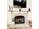 Stylish brick fireplace with decorative mantel, perfect for cozy evenings at 10229 N 12Th Ct # 1, Phoenix, AZ 85020