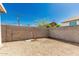 Gravel backyard featuring a block wall for privacy and security of the home at 1029 E Mckinley St, Phoenix, AZ 85006