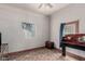 Bedroom featuring pink walls, a window, a closet, and a wood dresser at 1029 E Mckinley St, Phoenix, AZ 85006