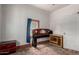 Bedroom featuring pink walls, a window, a closet, and a wood dresser at 1029 E Mckinley St, Phoenix, AZ 85006