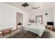 Bright bedroom with a ceiling fan, large windows, and carpeted floors at 1029 E Mckinley St, Phoenix, AZ 85006