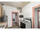Compact kitchen with gas range, and access to an adjoining room at 1029 E Mckinley St, Phoenix, AZ 85006