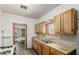 Functional kitchen featuring wood cabinets, dual sink, and gas range cooktop at 1029 E Mckinley St, Phoenix, AZ 85006