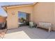 Relaxing back patio with lounge seating overlooking a sparkling pool through the sliding glass door at 10346 E Desert Dawn Dr, Gold Canyon, AZ 85118