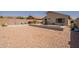 Spacious backyard featuring desert landscaping, a pool, patio area, perfect for relaxing or entertaining outdoors at 10346 E Desert Dawn Dr, Gold Canyon, AZ 85118