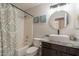 Stylish bathroom with granite vanity, modern vessel sink, and shower-tub combo at 10346 E Desert Dawn Dr, Gold Canyon, AZ 85118