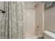 Clean bathroom featuring a shower-tub combination and stylish curtain at 10346 E Desert Dawn Dr, Gold Canyon, AZ 85118