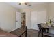 Comfortable bedroom with ceiling fan, wood laminate flooring, closet, and neutral walls at 10346 E Desert Dawn Dr, Gold Canyon, AZ 85118
