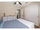 Comfortable bedroom with ensuite bath, ceiling fan, closet, and neutral walls at 10346 E Desert Dawn Dr, Gold Canyon, AZ 85118