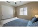 Charming bedroom featuring a whitewashed wood bed frame, ladder accent, and ample natural light at 10346 E Desert Dawn Dr, Gold Canyon, AZ 85118