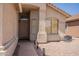 Home featuring a covered front porch, desert landscaping and a light-colored exterior at 10346 E Desert Dawn Dr, Gold Canyon, AZ 85118