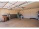 Spacious two-car garage featuring ample storage and an epoxy-coated floor for easy maintenance at 10346 E Desert Dawn Dr, Gold Canyon, AZ 85118