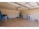 Clean, well-lit two car garage offering plenty of room for vehicles and storage solutions at 10346 E Desert Dawn Dr, Gold Canyon, AZ 85118