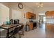 Stylish kitchen showcasing stainless steel appliances, wood cabinets, and a breakfast bar area for casual dining at 10346 E Desert Dawn Dr, Gold Canyon, AZ 85118