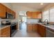 Bright kitchen showcasing wooden cabinets, stainless steel appliances, and an open layout with natural light at 10346 E Desert Dawn Dr, Gold Canyon, AZ 85118