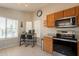 Eat-in kitchen features stainless steel appliances, countertops, light-colored cabinets, and tiled floor at 10346 E Desert Dawn Dr, Gold Canyon, AZ 85118