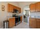 Efficient kitchen layout featuring stainless steel appliances, granite countertops, and ample cabinet storage at 10346 E Desert Dawn Dr, Gold Canyon, AZ 85118