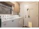 Functional laundry room with modern washer and dryer and plenty of storage space at 10346 E Desert Dawn Dr, Gold Canyon, AZ 85118