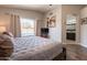 Comfortable main bedroom featuring a ceiling fan, and a window view of the pool at 10346 E Desert Dawn Dr, Gold Canyon, AZ 85118