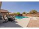 Backyard pool area with patio furniture, perfect for outdoor entertaining and enjoying sunny days at 10346 E Desert Dawn Dr, Gold Canyon, AZ 85118