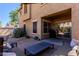 Inviting backyard with patio seating, lush landscaping, gravel beds, and exterior of home at 1145 E Lowell Ave, Gilbert, AZ 85295