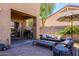 Backyard patio with outdoor seating, BBQ, and sliding glass door at 1145 E Lowell Ave, Gilbert, AZ 85295