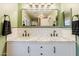 Modern bathroom featuring a double vanity with marble countertop and subway tile backsplash at 1145 E Lowell Ave, Gilbert, AZ 85295