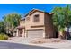Charming two-story home featuring a neutral color scheme, attached two-car garage, and well-maintained landscaping at 1145 E Lowell Ave, Gilbert, AZ 85295
