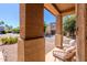 Inviting front porch with a cozy seating area, offering a welcoming entrance to this charming home at 1145 E Lowell Ave, Gilbert, AZ 85295