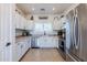 Well-lit kitchen featuring stainless steel appliances, light countertops and shaker cabinets at 1145 E Lowell Ave, Gilbert, AZ 85295