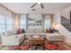 Bright living room with a comfortable sectional sofa, stylish rug, and natural light, creating a welcoming atmosphere at 1145 E Lowell Ave, Gilbert, AZ 85295