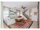 Spacious living room with a comfortable sectional sofa, stylish rug, and natural light, creating a welcoming atmosphere at 1145 E Lowell Ave, Gilbert, AZ 85295
