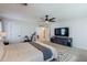 Spacious main bedroom offering fan, TV, walk-in closet, and comfy layout with carpet at 1145 E Lowell Ave, Gilbert, AZ 85295