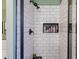Modern shower features black fixtures, subway tile and a built-in storage niche at 1145 E Lowell Ave, Gilbert, AZ 85295