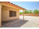 A spacious backyard with a covered patio perfect for outdoor entertaining at 12441 W Windsor Blvd, Litchfield Park, AZ 85340