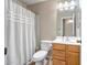 Bathroom featuring a shower/tub combo, toilet, and vanity with a mirror at 12441 W Windsor Blvd, Litchfield Park, AZ 85340