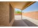 Covered patio with a private, low-maintenance gravel backyard at 12441 W Windsor Blvd, Litchfield Park, AZ 85340