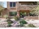 Exterior view of the home with a landscaped backyard and a covered patio at 13300 E Via Linda Dr # 1058, Scottsdale, AZ 85259