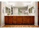 Elegant bathroom with a double vanity, framed mirror, and stylish fixtures at 13300 E Via Linda Dr # 1058, Scottsdale, AZ 85259